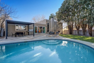 An amazing contemporary split-level home near Arroyo Del Oso on Arroyo Del Oso Golf Course in New Mexico - for sale on GolfHomes.com, golf home, golf lot