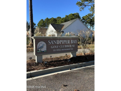 Don't Miss This First Floor - Golf  Pond View Condo in Sandpiper on Sandpiper Bay Golf and Country Club in North Carolina - for sale on GolfHomes.com, golf home, golf lot