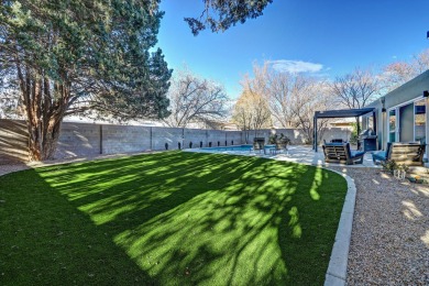 An amazing contemporary split-level home near Arroyo Del Oso on Arroyo Del Oso Golf Course in New Mexico - for sale on GolfHomes.com, golf home, golf lot