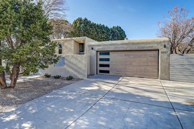 An amazing contemporary split-level home near Arroyo Del Oso on Arroyo Del Oso Golf Course in New Mexico - for sale on GolfHomes.com, golf home, golf lot