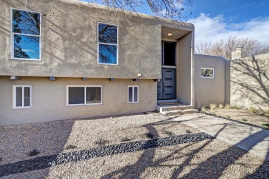 An amazing contemporary split-level home near Arroyo Del Oso on Arroyo Del Oso Golf Course in New Mexico - for sale on GolfHomes.com, golf home, golf lot