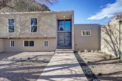 An amazing contemporary split-level home near Arroyo Del Oso on Arroyo Del Oso Golf Course in New Mexico - for sale on GolfHomes.com, golf home, golf lot