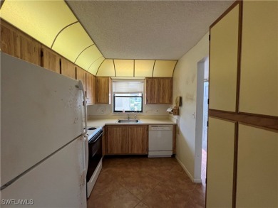 First-floor 2-bedroom, 2-bath condo located in the welcoming 55+ on Golden Gate Country Club in Florida - for sale on GolfHomes.com, golf home, golf lot