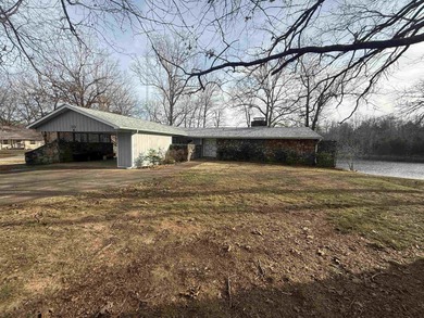 This charming 3-bedroom, 2.5-bath home sits on Lake Omaha in on Cherokee Village South Course in Arkansas - for sale on GolfHomes.com, golf home, golf lot