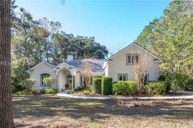 Enjoy the incredible sunset views of a large lagoon and bird on Callawassie Island Club in South Carolina - for sale on GolfHomes.com, golf home, golf lot