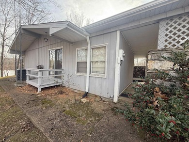 This charming 3-bedroom, 2.5-bath home sits on Lake Omaha in on Cherokee Village South Course in Arkansas - for sale on GolfHomes.com, golf home, golf lot