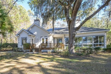 Enjoy the incredible sunset views of a large lagoon and bird on Callawassie Island Club in South Carolina - for sale on GolfHomes.com, golf home, golf lot