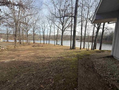 This charming 3-bedroom, 2.5-bath home sits on Lake Omaha in on Cherokee Village South Course in Arkansas - for sale on GolfHomes.com, golf home, golf lot