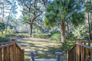 Enjoy the incredible sunset views of a large lagoon and bird on Callawassie Island Club in South Carolina - for sale on GolfHomes.com, golf home, golf lot