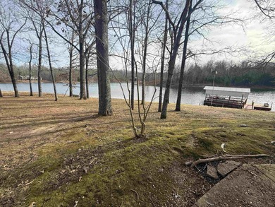 This charming 3-bedroom, 2.5-bath home sits on Lake Omaha in on Cherokee Village South Course in Arkansas - for sale on GolfHomes.com, golf home, golf lot