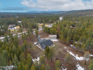 MOVE IN READY! Stunning custom home situated on 4.8 treed acres on Twin Lakes Village Golf Course in Idaho - for sale on GolfHomes.com, golf home, golf lot