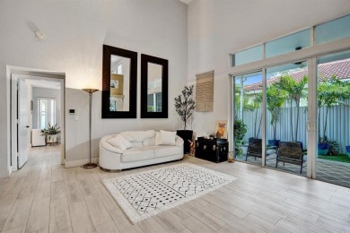 Spacious and beautifully updated 2-story home located in a on Palm-Aire Country Club and Resort - The Oaks in Florida - for sale on GolfHomes.com, golf home, golf lot