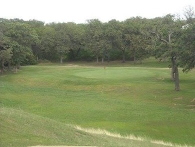 Golfers dream this beautiful build site over looking holes 1 and on Nocona Hills Golf Course in Texas - for sale on GolfHomes.com, golf home, golf lot