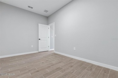 One or more photo(s) has been virtually staged. Walk to PINE on The Grand Club - Pine Lakes Course in Florida - for sale on GolfHomes.com, golf home, golf lot