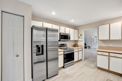 Spacious and beautifully updated 2-story home located in a on Palm-Aire Country Club and Resort - The Oaks in Florida - for sale on GolfHomes.com, golf home, golf lot