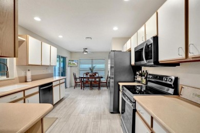 Spacious and beautifully updated 2-story home located in a on Palm-Aire Country Club and Resort - The Oaks in Florida - for sale on GolfHomes.com, golf home, golf lot