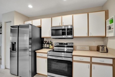 Spacious and beautifully updated 2-story home located in a on Palm-Aire Country Club and Resort - The Oaks in Florida - for sale on GolfHomes.com, golf home, golf lot