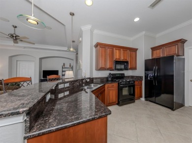This stunning WCI-built  home offers a picturesque view from on Venetian Golf and River Club in Florida - for sale on GolfHomes.com, golf home, golf lot
