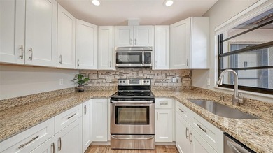 Must-see beautifully furnished villa, updated, end unit and a on The Meadows Golf and Country Club in Florida - for sale on GolfHomes.com, golf home, golf lot