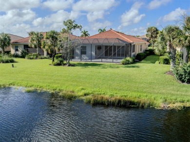 This stunning WCI-built  home offers a picturesque view from on Venetian Golf and River Club in Florida - for sale on GolfHomes.com, golf home, golf lot