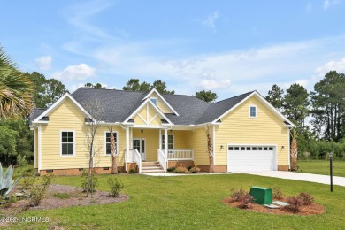 Welcome to your coastal sanctuary, where the tranquil shores of on Lockwood Folly Country Club in North Carolina - for sale on GolfHomes.com, golf home, golf lot