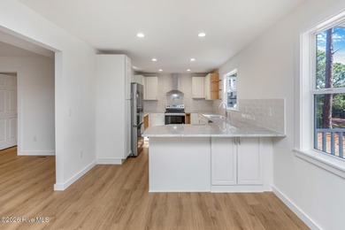 Recently renovated golf-front home perfectly positioned on the on Seven Lakes Country Club in North Carolina - for sale on GolfHomes.com, golf home, golf lot