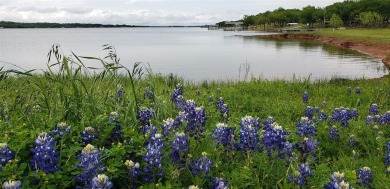 Beautiful corner lot build site with lake views and mature oak on Nocona Hills Golf Course in Texas - for sale on GolfHomes.com, golf home, golf lot