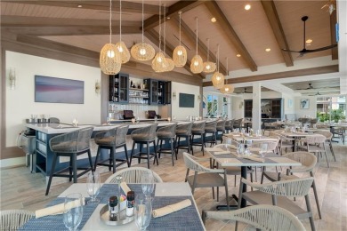 Step off of your private elevator and directly into this on West Bay Beach and Golf Club in Florida - for sale on GolfHomes.com, golf home, golf lot