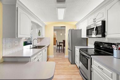 Well kept & Solid - FAIRFAX Model Corner-Lot home with 1682 on Mainlands Golf Club in Florida - for sale on GolfHomes.com, golf home, golf lot