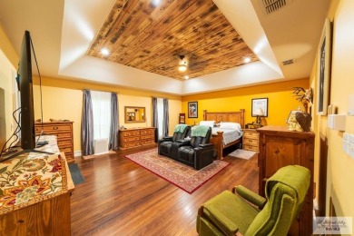 Tucked along the fairway in Rancho Escondido, this 4,037 sq ft on Rancho Viejo Resort and Country Club in Texas - for sale on GolfHomes.com, golf home, golf lot