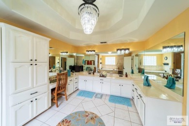 Tucked along the fairway in Rancho Escondido, this 4,037 sq ft on Rancho Viejo Resort and Country Club in Texas - for sale on GolfHomes.com, golf home, golf lot