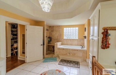Tucked along the fairway in Rancho Escondido, this 4,037 sq ft on Rancho Viejo Resort and Country Club in Texas - for sale on GolfHomes.com, golf home, golf lot
