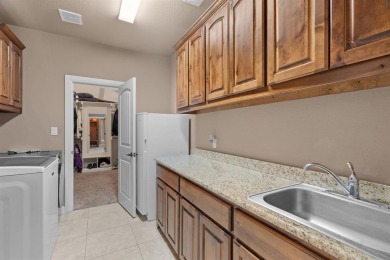 Beautifully maintained 4-bedroom, 2.5-bath home on a half-acre on Pecan Plantation Country Club in Texas - for sale on GolfHomes.com, golf home, golf lot