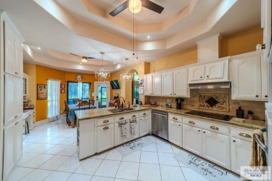 Tucked along the fairway in Rancho Escondido, this 4,037 sq ft on Rancho Viejo Resort and Country Club in Texas - for sale on GolfHomes.com, golf home, golf lot