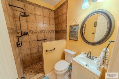 Tucked along the fairway in Rancho Escondido, this 4,037 sq ft on Rancho Viejo Resort and Country Club in Texas - for sale on GolfHomes.com, golf home, golf lot