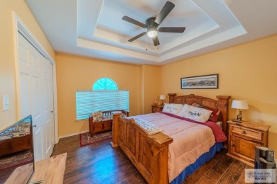 Tucked along the fairway in Rancho Escondido, this 4,037 sq ft on Rancho Viejo Resort and Country Club in Texas - for sale on GolfHomes.com, golf home, golf lot
