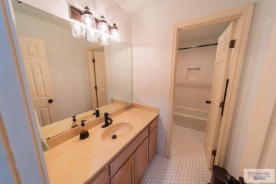 Tucked along the fairway in Rancho Escondido, this 4,037 sq ft on Rancho Viejo Resort and Country Club in Texas - for sale on GolfHomes.com, golf home, golf lot