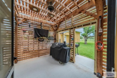 Tucked along the fairway in Rancho Escondido, this 4,037 sq ft on Rancho Viejo Resort and Country Club in Texas - for sale on GolfHomes.com, golf home, golf lot
