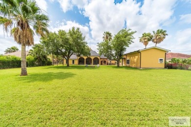 Tucked along the fairway in Rancho Escondido, this 4,037 sq ft on Rancho Viejo Resort and Country Club in Texas - for sale on GolfHomes.com, golf home, golf lot
