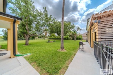 Tucked along the fairway in Rancho Escondido, this 4,037 sq ft on Rancho Viejo Resort and Country Club in Texas - for sale on GolfHomes.com, golf home, golf lot