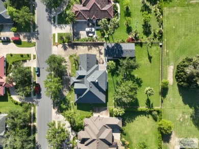 Tucked along the fairway in Rancho Escondido, this 4,037 sq ft on Rancho Viejo Resort and Country Club in Texas - for sale on GolfHomes.com, golf home, golf lot