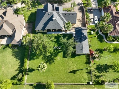 Tucked along the fairway in Rancho Escondido, this 4,037 sq ft on Rancho Viejo Resort and Country Club in Texas - for sale on GolfHomes.com, golf home, golf lot
