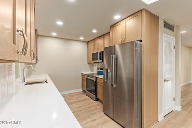 This stunning Sun City residence has been fully remodeled and is on Sun City Lakes West and East in Arizona - for sale on GolfHomes.com, golf home, golf lot