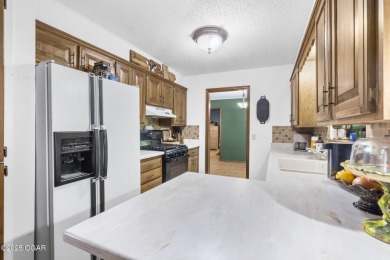 This 3-bedroom, 2-bath home has 1,676 sq. ft. of living space on Bella Vista Country Club and Golf Course in Arkansas - for sale on GolfHomes.com, golf home, golf lot