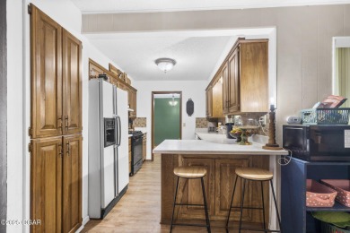 This 3-bedroom, 2-bath home has 1,676 sq. ft. of living space on Bella Vista Country Club and Golf Course in Arkansas - for sale on GolfHomes.com, golf home, golf lot