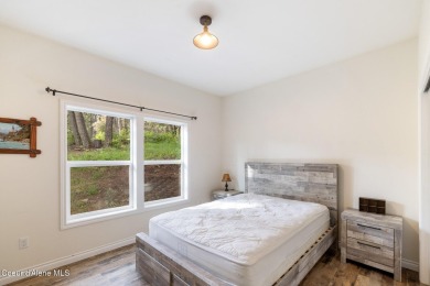 Discover lakefront living at its finest on Lake San Souci! This on Stoneridge Golf Club in Idaho - for sale on GolfHomes.com, golf home, golf lot