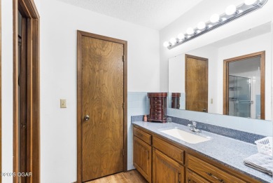 This 3-bedroom, 2-bath home has 1,676 sq. ft. of living space on Bella Vista Country Club and Golf Course in Arkansas - for sale on GolfHomes.com, golf home, golf lot