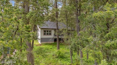 Discover lakefront living at its finest on Lake San Souci! This on Stoneridge Golf Club in Idaho - for sale on GolfHomes.com, golf home, golf lot