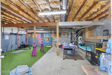 This 3-bedroom, 2-bath home has 1,676 sq. ft. of living space on Bella Vista Country Club and Golf Course in Arkansas - for sale on GolfHomes.com, golf home, golf lot