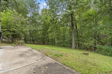 This 3-bedroom, 2-bath home has 1,676 sq. ft. of living space on Bella Vista Country Club and Golf Course in Arkansas - for sale on GolfHomes.com, golf home, golf lot